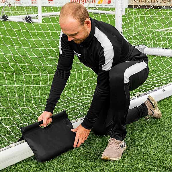 A Sandbag Used To secure the back of a soccer goal A Sandbag can be used to secure the back of a soccer goal